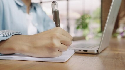 Asian Student female wear headphones learn watching online webinar webcast class looking at laptop,Asian Young Woman studying online at home