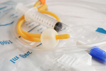 Fototapeta na wymiar Foley catheter and urine drainage bag collect urine for disability or patient in hospital.