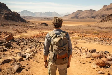 Fototapete Arizona Adventurer exploring a remote desert landscape - stock photography concepts