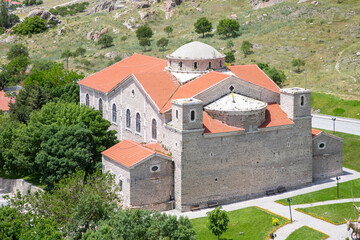 Sivrihisar, Eskisehir, Turkey - June 16 2023: Aerial view of Sivrihisar city with Surp Yerrortutyun Armenian Church at sunset.