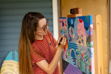 Artist woman with a painting