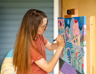 Artist woman with a painting