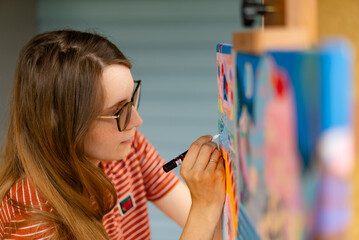 Artist woman with a painting