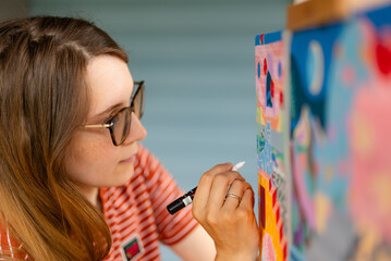 Artist woman with a painting