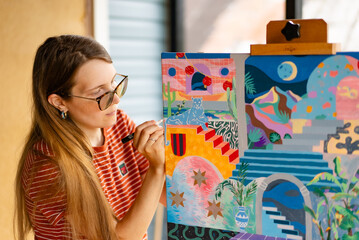 Artist woman with a painting