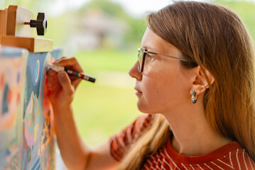Artist woman with a painting