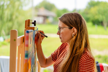 Artist woman with a painting
