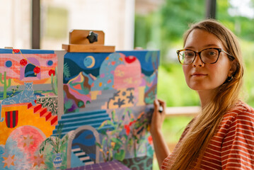 Artist woman with a painting