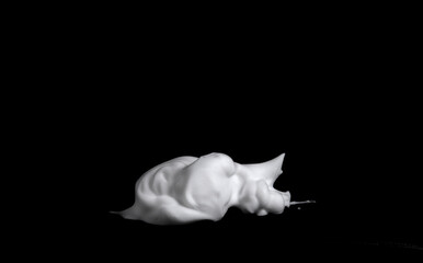 Naklejka premium liquid white foam from soap or shampoo or shower gel Abstract soap bubbles. Set foam, soap bubble isolated on black, with clipping path texture and background. 