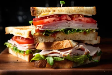 Photo sur Plexiglas Snack A perfectly stacked triple decker club sandwich filled with turkey, ham, cheese, and tomatoes, ready to be devoured, in a close-up view.