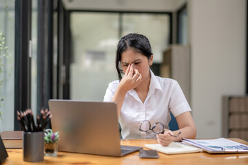 Fototapeta premium Stressed businesswoman working from laptop, project documentation error, Notify news of damage by email