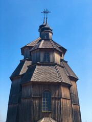 Wooden vintage church full height in Zaporozhian Sich medieval village, state of Cossacks on Khortytsia island, Ukraine.