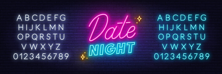 Date Night neon sign on brick wall background.