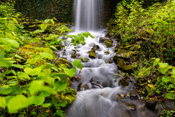 Waterfall and creek or brook in Iserlohn Sauerland Germany after heavy rain. Long time exposure of...