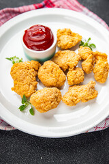 homemade nuggets with tomato sauce deep-fried chicken meat ready to eat healthy meal food snack on the table copy space food background rustic top view
