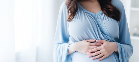 Pretty Expectant Mother in Delicate Blue Textiles