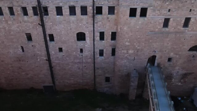 Acre Prison. Akko.
The outer wall of the ancient English prison in Acre
Prison windows with bars
The crossing bridge over the canal
Drone view