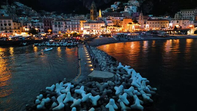 Amalfi by Night: Aerial View of the Famous Colorful Houses on the Amalfi Coast, Illuminated under the Night Sky, Perfect for Tourism