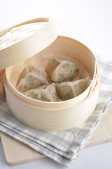 steamed handmade crystal vegetable prawn shrimp dumpling har gao in bamboo basket on white background vegan appetiser dim sum snack Halal food restaurant cuisine menu for cafe