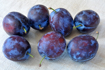 Sweet, delicious plums on a linen cloth