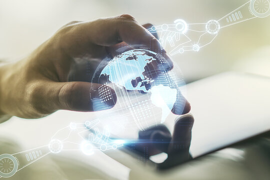 Double exposure of robotics technology with world map hologram and finger clicks on a digital tablet on background. Research and development software concept - Powered by Adobe