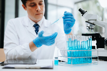 Modern medical research laboratory. female scientist working with micro pipettes analyzing...