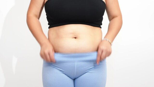 Weight loss process, women belly fat, postpartum belly horizontal 4k footage. Lifting of the body with sport and fitness. Healthy way of life
