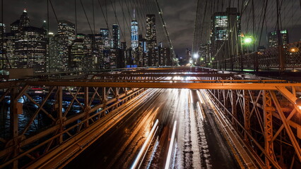 Fototapeta na wymiar Heavy traffic on the Brooklyn Bridge in rainy weather. NYC, USA.