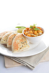 Indian vegetable bean curry sauce with baked naan pizza toast bread kebab breakfast on white background asian chef appetiser halal bakery food restaurant pastry menu for cafe