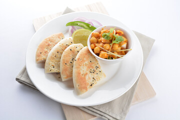 Indian vegetable bean curry sauce with baked naan pizza toast bread kebab breakfast on white background asian chef appetiser halal bakery food restaurant pastry menu for cafe