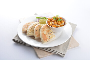 Indian vegetable bean curry sauce with baked naan pizza toast bread kebab breakfast on white background asian chef appetiser halal bakery food restaurant pastry menu for cafe
