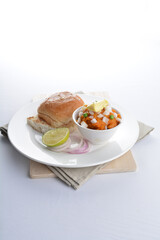 indian vegetable bean curry with baked bread bun burger toast onion lime breakfast on white background asian chef appetiser halal bakery food restaurant pastry menu for cafe
