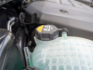 Tank of liquid antifreeze of the cooling system of the car radiator system. Tank with antifreeze...