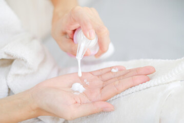 Woman applying natural cream, Woman moisturizing her hand with cosmetic cream, Spa and Manicure concept.