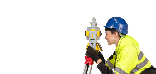 Woman in blue hard hat and yellow protective clothes land surveyor working with modern surveying...
