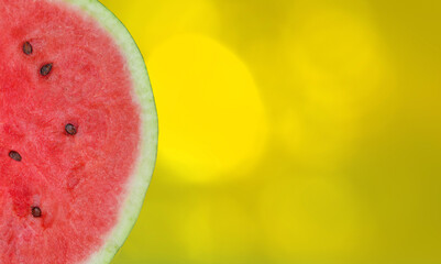 Slice watermelon border isolated on summer background in backlight. Watermelon pulp with copy space.