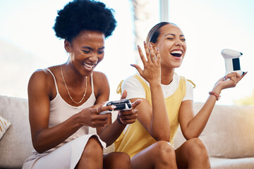 Women on sofa playing video game, laughing and relax in home living room together on internet with controller. Online gaming, esports and happy gamer girl friends on couch on virtual app in apartment © Ramba/peopleimages.com
