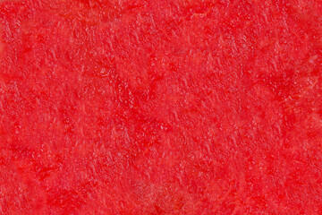 Red watermelon texture, fruity pulp. Abstract background texture of watermelon flesh.