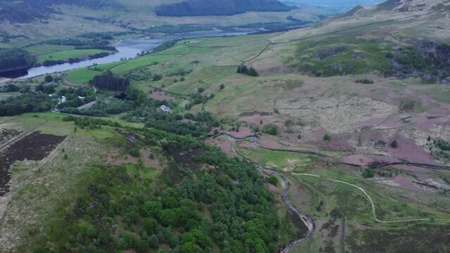 Fields, forest and river as usual rural England landscape in Peak District, Yorkshire. Aerial shot	