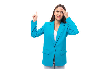 tired stylish young brunette businesswoman in a blue jacket in an image on a white background with copy space