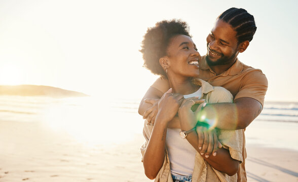 Smile, Hug And Couple At The Beach At Sunset For Travel, Romance And Relax In Nature Together. Love, Freedom And Happy Man With Black Woman At Sea Embrace, Connect And Enjoy Ocean Adventure In Miami