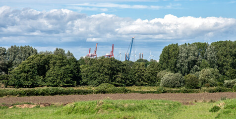 The cranes and wind turbines of Royal Portbury Dock, Bristol, England, United Kingdom