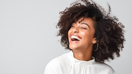 Beautiful african american girl with an afro hairstyle smiling. Smiling beautiful afro girl. Curly black hair. Emotion concept.
 - Powered by Adobe