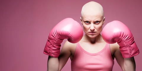 Foto op Plexiglas bald woman with pink boxing gloves ready to fight breast cancer © Axel Bueckert