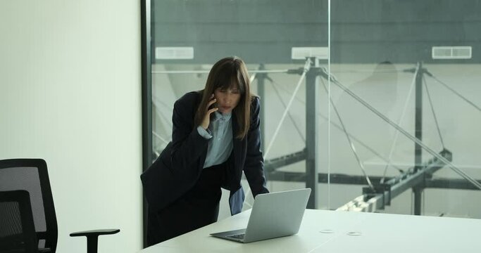 Capable female entrepreneur is engrossed in phone negotiations. With a confident and assertive tone, she navigates through the conversation, showcasing her excellent negotiation skills.