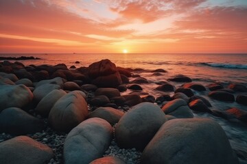 Obraz premium Very nice sunset on a beach with many rocks
