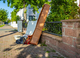 Bulk garbage day concept, miscellaneous rubbish items put on a street for council bulk waste...