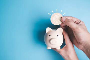 Hand with piggy bank and target icon, Financial business investment, Growing money, People saving...