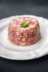 brawn food meat Sülze pieces of meat in jelly pork, beef meat product ready to eat healthy meal food snack on the table copy space food background rustic top view