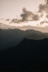 View of mountains from the top of Pico das Agulhas Negras in Itamonte MG. Beautiful landscape with mountains and sun rays.
